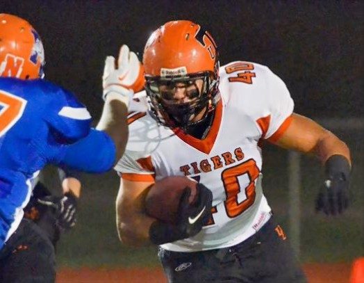 Danny carrying the ball in high school